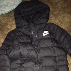 Medium sized Nike puffer jacket for women.